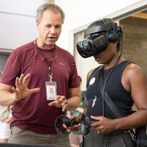 Professor teaches user how to play a virtual reality game